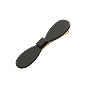 Minimalist matte black acetate bow hair clip with gold metal base for women's hairstyling