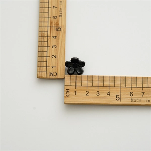 Mini 1.3cm black flower hair clip for women featuring a glossy resin floral claw design