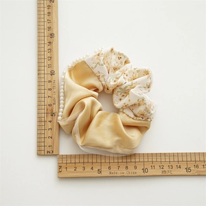 Floral satin oversized scrunchie with lace and faux pearls, measuring 11cm diameter