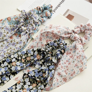 Detail of floral chiffon scrunchies with long ribbons in assorted vintage patterns
