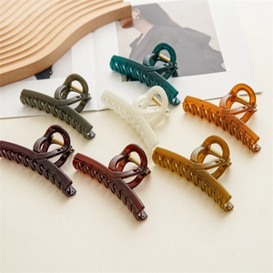 Detailed set of seven matte jelly color hair claw clips in various elegant hues for women