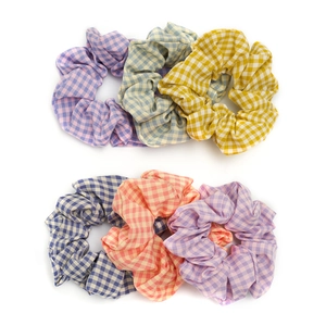 Set of six colorful plaid scrunchies in cotton fabric for elegant ponytail hair styling
