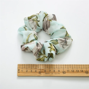 Floral print oversized scrunchie in mint green chiffon with 10cm diameter measurement