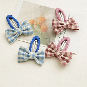 Set of 4 checkered fabric bow hair clips in blue and pink for girls and women
