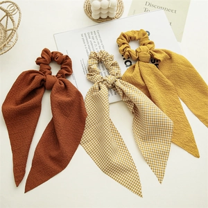 Set of plaid and solid color scrunchies with long ribbons for elegant ponytails