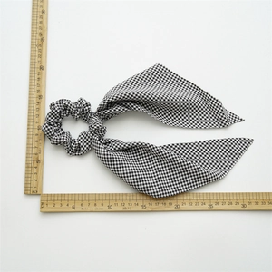 Classic black and white checkered plaid scrunchie with a long ribbon streamer for hair
