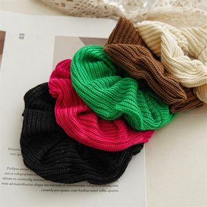 Large knitted scrunchie set in assorted colors with ribbed texture and soft wool material