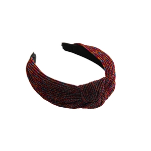 Sparkly wide knotted headband with metallic glitter fabric and non-slip lining