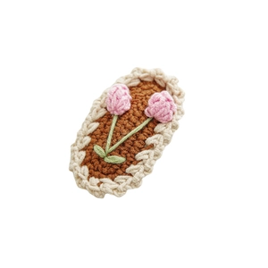 Handmade knitted flower hair clip with pink tulips on brown oval base for girls