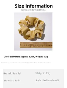 Champagne satin scrunchie detail showing 12cm diameter and premium silky texture