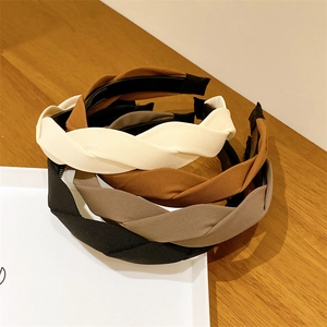 Detail of twisted braided headbands with non-slip tooth combs in earthy color palettes