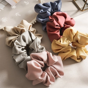 Set of 6 satin silk scrunchies in assorted Morandi colors with soft ruffled texture