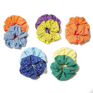 Five sets of colorful solid and polka dot scrunchie hair ties for women in chic style