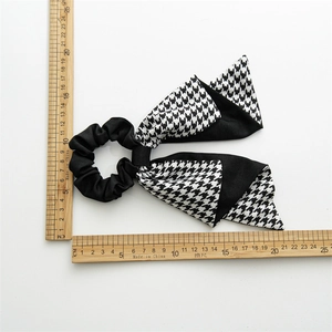 Classic black and white houndstooth bow scrunchie for women with elegant long ribbons