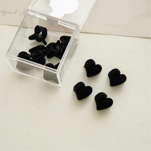 Mini black velvet heart hair claws in a transparent storage box for styling