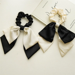 Elegant houndstooth ribbon scrunchies with long bow design in black and white silk