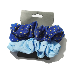 Polka dot and solid blue hair scrunchie set on display card for autumn chic styling