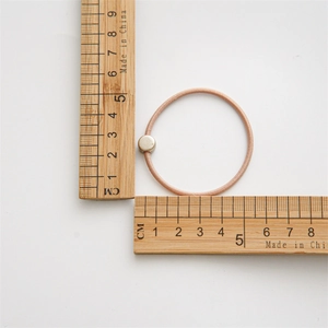 Minimalist coffee-colored 10-piece elastic hair tie with golden circular bead ornament