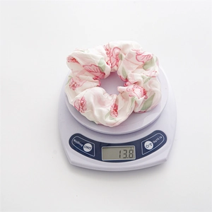Pastel floral satin scrunchie with pink rose print on white background weight 13.8g