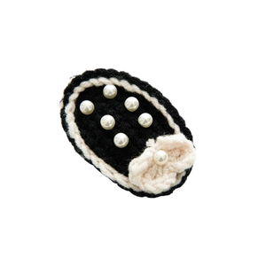 Handmade black knitted hair clip with pearls and beige bow, elegant vintage style