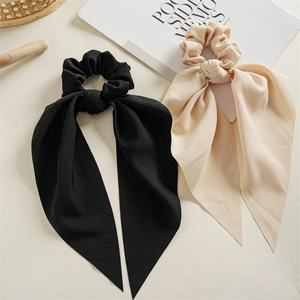 Elegant ponytail hair scrunchie with long ribbons in black and apricot chiffon fabric