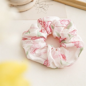 Detail of pink floral scrunchie with ivory satin fabric and vintage aesthetic card