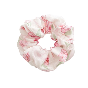 Floral satin scrunchie with pink rose patterns on a white background for women