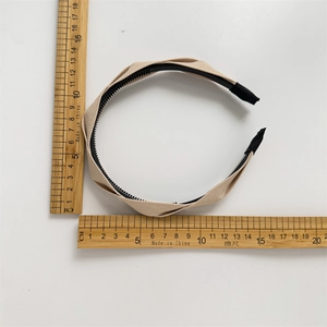 Beige pleated fabric headband with wave edges and non-slip inner comb for women