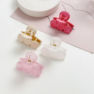 Set de cuatro pinzas redondas para el pelo en rosa y blanco para un peinado elegante