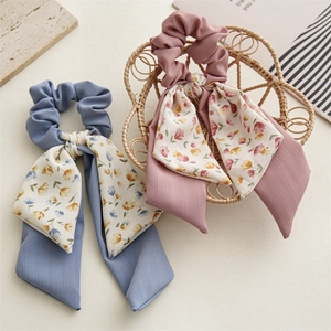 Floral print bow scrunchies with long ribbons in light blue and pink purple colors
