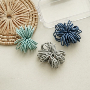 Detailed set of high elastic hair ties in mint green, grey, and navy blue colors