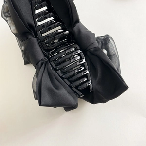 Elegant large shark clip with black bow and white pearls for women's hairstyle
