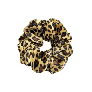 Classic leopard print satin scrunchie with elastic hair band on white background