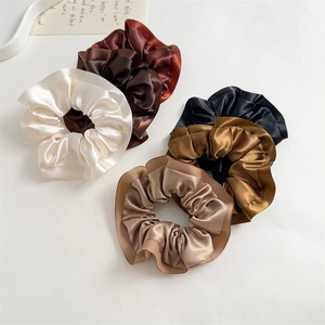 Set of 5 large satin scrunchies in neutral tones like beige, coffee, and champagne