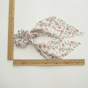 Floral print hair scrunchie with long ribbons measured at 32cm on white background