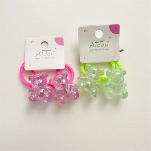 Detail of jelly bear hair ties with iridescent polar effect and woven elastic bands