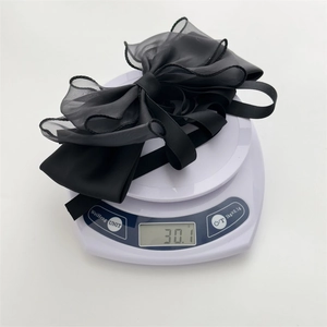Weight measurement of 30.1g for large double black bow hair claw clip with organza ribbon