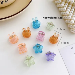 Detail shot of mini floral and animal hair clips showing dimensions and net weight 1.2g