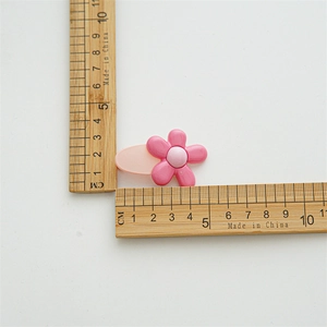 Detailed view of pink flower hair clip with ruler showing dimensions of 4.5cm length