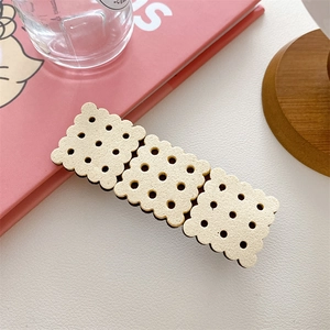 Detailed view of creative soda biscuit hair clip with realistic resin cookie texture