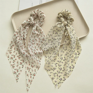 Floral chiffon scrunchies with long ribbons in cream and yellow for elegant ponytails