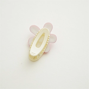 Detailed back view of pink floral hair clip showing the duckbill clip structure