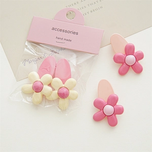 Cute pink and cream flower hair clips set with matte finish on elegant paper card
