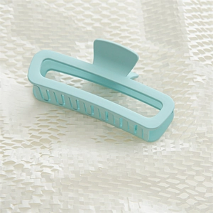Macro detail of a 13cm matte light blue rectangular hollow shark hair claw clip