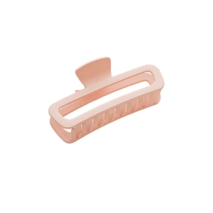 Matte light pink 13cm shark hair claw clip for women's buns on white background