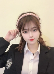 Pink and white plaid fabric headband worn by a model in sweet preppy style