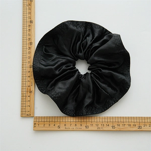 Large black satin scrunchie with ruffled edges showing 13-14cm size measurement