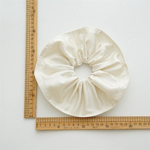 20cm oversized beige satin scrunchie with elegant pleated fabric and silky texture