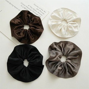 Set of four 20cm satin scrunchies in brown, beige, black, and grey with ruffle edges
