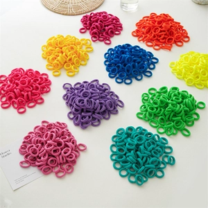 Macro shot of colorful seamless elastic hair ties in various vibrant shades for kids